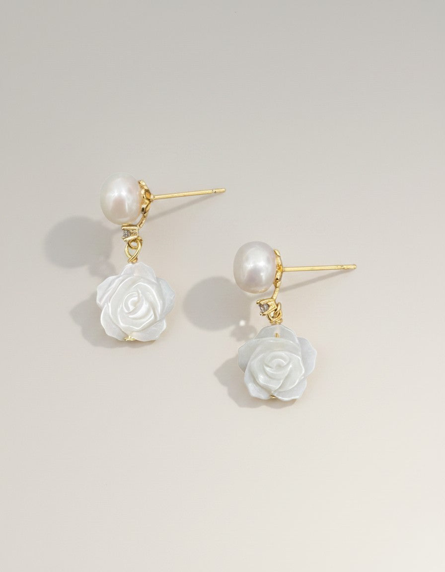 Muchicere Pearl and Rose Carved Mother Of Pearl Dangle Earrings with cubic zirconia accent.
