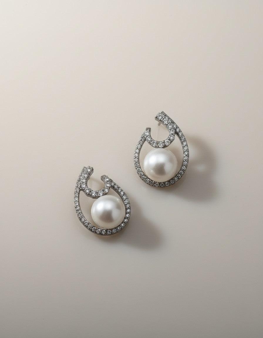 Muchier elegant sterling silver drop earrings with pearls and cubic zirconia in an open teardrop design.