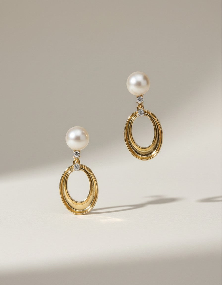 Muchi 14k yellow gold oval drop earrings with pearls and diamond accents.