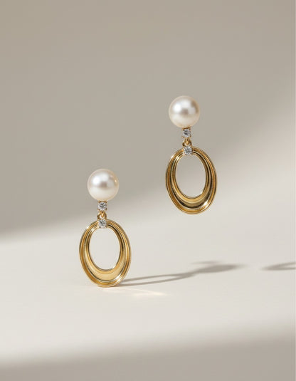 Muchi 14k yellow gold oval drop earrings with pearls and diamond accents.