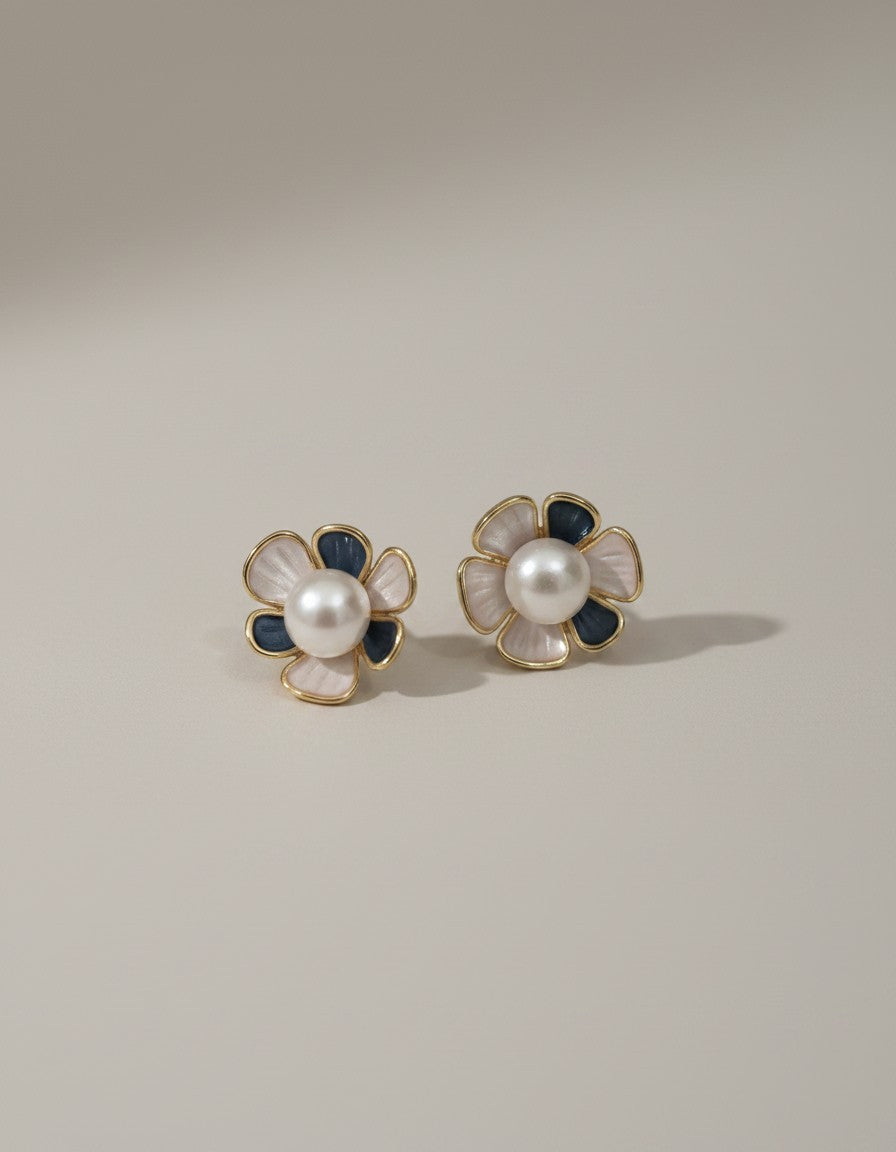 Muchich Flower pearl stud earrings with pink enamel petals and navy blue accents, gold trim.