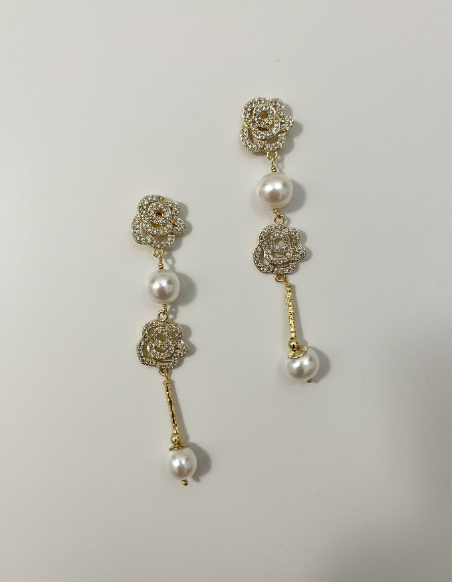 Muchichere Rhinestone Rose Pearl Drop Earrings with asymmetric design, gold-tone finish, cubic zirconia, and faux pearls.