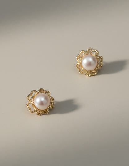 Muchier elegant pearl flower stud earrings with gold-tone filigree setting.