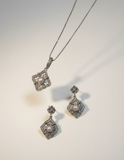 Muchier sterling silver pendant necklace and drop earrings set with pearls and cubic zirconia, featuring ornate filigree detailing.