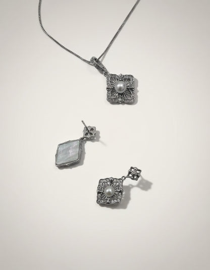 Muchier sterling silver pendant necklace and matching earrings set with pearls and cubic zirconia. Vintage filigree design.