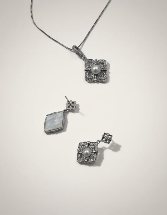 Muchier sterling silver pendant necklace and matching earrings set with pearls and cubic zirconia. Vintage filigree design.