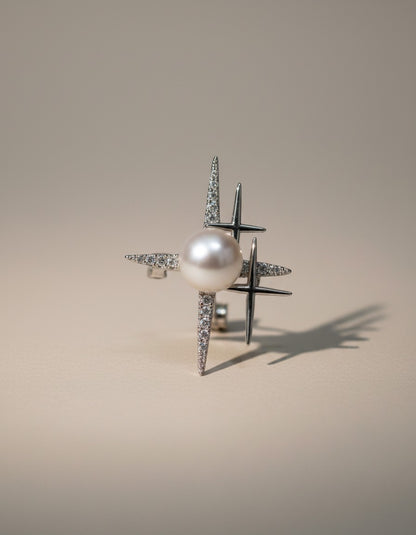 Muchier sterling silver ring with pearl and starburst design adorned with cubic zirconia stones.