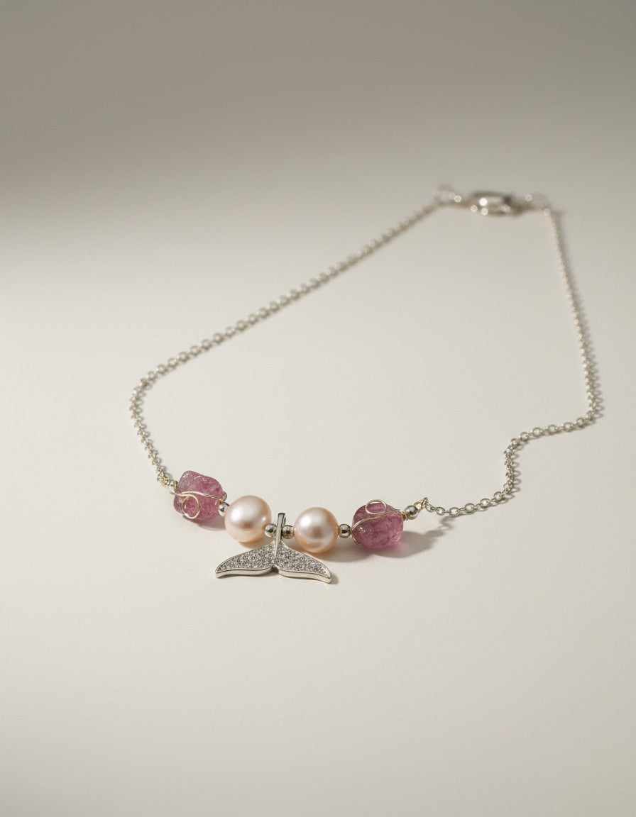 Muchier sterling silver necklace with whale tail pendant, cubic zirconia, freshwater pearls, and raw pink tourmaline stones.
