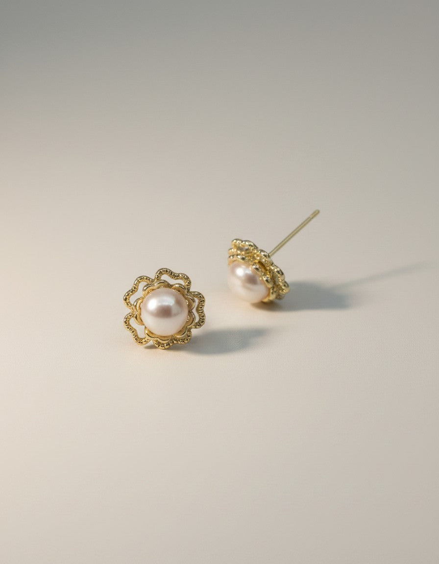 Muchiere Elegant pearl flower stud earrings with gold-tone filigree setting. Creamy pearls with openwork petals.