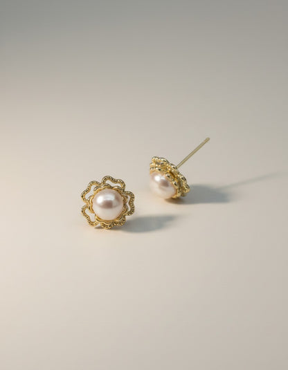 Muchiere Elegant pearl flower stud earrings with gold-tone filigree setting. Creamy pearls with openwork petals.